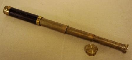 Late 19th century hand-held refracting telescope, maker unknown. With three brass draws and mahogny bound tube. 