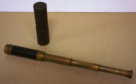 Early 20th century hand-held refracting telescope, maker unknown. Three brass draws and leather bound tube. Incl original case. 