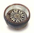 Early 19th century dry card compass, mounted in wooden bowl. Maker unknown.