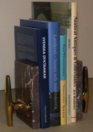 Book supports in marble with brass cleats.