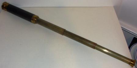 Late 19th century hand-held refracting telescope, maker unknown. Three brass draws and leather bound tube.