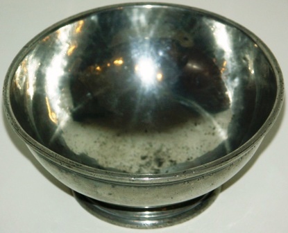 19th century bowl made of pewter from H.M.S. Andromeda's mess. 