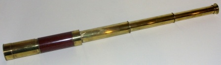 19th century hand-held refracting telescope. Made by J.J. Messer, London. Three brass draws and mahogany bound tube.