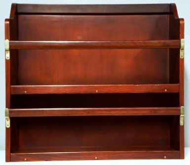 Wall-mounted mahogany bookshelf. From the Italian liner M/N G. Verdi. Two compartments, detachable rails. 