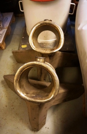 A pair of scuppers in brass. 