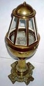Late 19th century yacht binnacle with dry card compass mounted in gimbals beneath the glass dome, fitted with six glass windows on a circular brass base. Maker unknown.