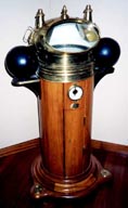 Late 19th century ship's binnacle with dry card compass mounted in gimbals. Brass dome with kerosene lamps mounted on mahagony stand. Made by Ivar Weilbach, Kjøbenhavn.