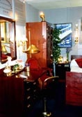 Exhibited study combine with compact living, furnished with restored 20th century ship's chest of drawers including sliding topleaf, mirror, swivel-chair, armchair, wardrobe, bunk bed, bedside table, original poster and newly made brass lamps.