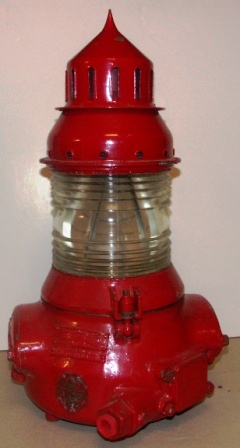 20th century beacon made by Gas-accumulator Stockholm, System AGA Dalén. No 182. Owned and used by Kongelig Dansk Fyr- & Vagervæsen/The Royal Danish Lighthouse and Road Authority (K.D.F. & V.). Red painted copper and brass.