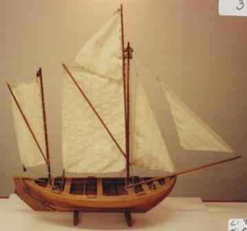 20th century clinker-built and copper-riveted wooden sailing boat with spritsails.