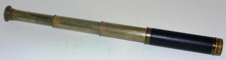 Early 20th century hand-held refracting telescope, maker unknown. Three brass draws and leather bound tube.