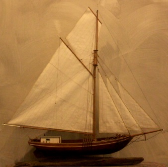 20th century wooden sloop, as used in Stockholms archipelago, mounted on salvaged wooden base. 