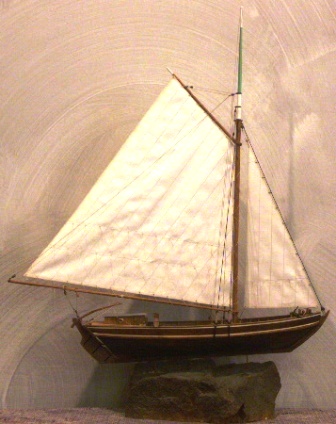 20th century wooden cargo boat, as used in Stockholms archipelago for transportation of sand, mounted on stone base.