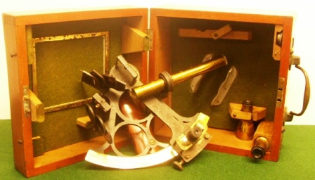 20th century sextant in original mahogany case. Made by T.L. Ainsley, South Shields, circle frame, silver scale and adjustable magnifier to assist scale readings, three telescopes and one sun-filter. 