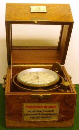 20th century two-day marine chronometer mounted in gimbal in original mahogany case fitted with brass carrying handles. Made by VEB Glashutter Uhrenbetriebe, # 4908. 