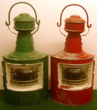 A pair of early 20th century navigation lamps with oil-burning lamps missing, red and green painted galvanized port and starboard case. 
