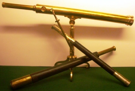 19th century hand-held and stand-mounted telescopes bound in leather, ray-skin or mahogany veneer.