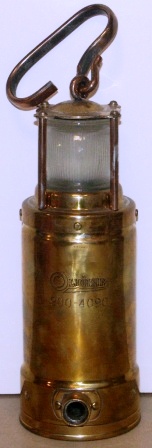 1930's/1940's battery driven emergency light. Made by Oldham England, No 900-4090. Brass, detachable handle. 