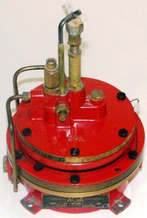 20th century gas-fired beacon ignition apparatus made by AGA Gasaccumulator Stockholm, System Dalén. Made of red-painted brass.