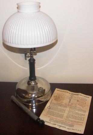 Early 20th century chrome-plated "Diamond" kerosene lamp with ribbed glass-shade. Made by Akron Lamp Company, Ohio U.S.A. Incl operating instructions and original accessories.