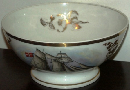 19th century Captains' bowl made in porcelain and used for presentation to captains sailing through the Sound of Elsinore, Denmark. Decorated with a finely painted Danish two-mast sailing vessel. Signed with initials and dated November 14, 1859. 