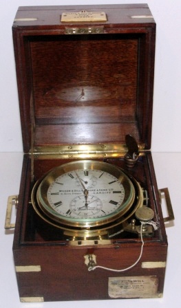19th century two days marine chronometer No 7149. Made by Wilson & Gillie Bruce & Sons Ltd, 91 Bute Street, Cardiff and at Dock View Road Barry Dock. Mounted in brass gimbals, mahogany case and brass fittings.