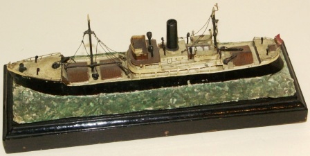 20th century metal built model / cigarette lighter, mounted on wooden base. Depicting the British freighter Alice-London. 
