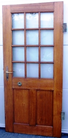 Early 20th century ships door in teak with brass fittings. Excl door frame.