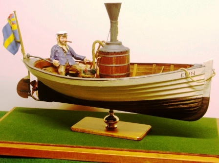 20th century built model depicting the 19th century steam-skiff powered ELIN with Captain Sune at the tiller