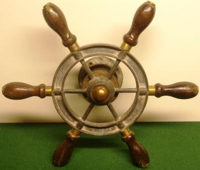 20th century six-spoked galvanized steering wheel with handles in mahogany and brass. 