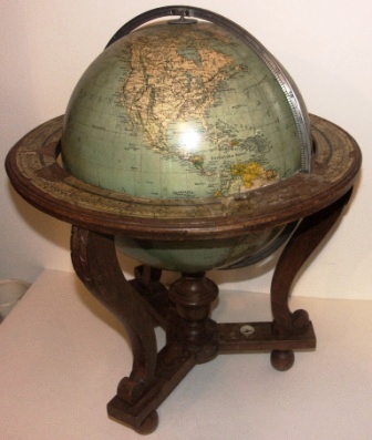 Early 20th century Columbus globe with compass. Oak stand. Imported by Edwin Hammar, Stockholm. (Requires minor attention). 
