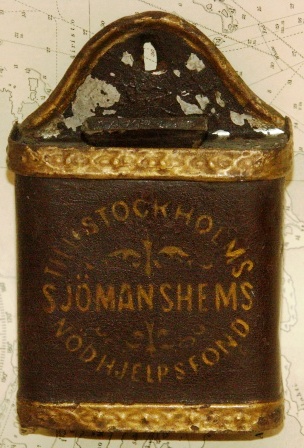 19th century savings-box made in painted tin-plate for the benefit of ''Stockholms Sjömanshems Nödhjelpsfond''