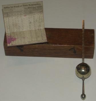 Late 19th century silver-plated marine hydrometer. In original mahogany case. Incl hydrometer tables by J.W. Gillie.
