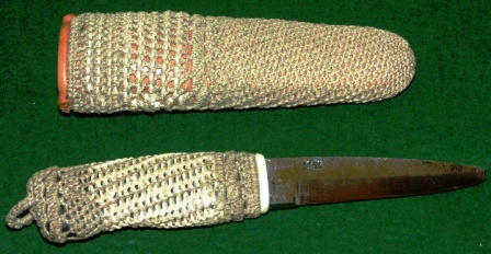 Knife with handforged steel-blade carrying the initials J.A. Handle and leather sheath rope-coated. 