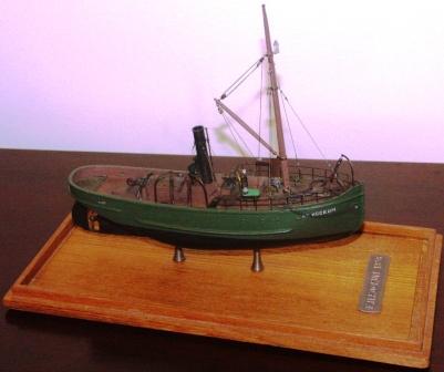F.H. Kockum 1876. Depicting the first icebreaking tug-boat built by Kockums Shipyard (Malmö, Sweden) in 1876. 20th century model. Very fine details. Mounted in a glass case.