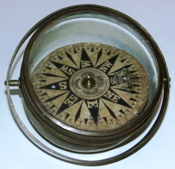 19th century dry card compass mounted in gimbals.