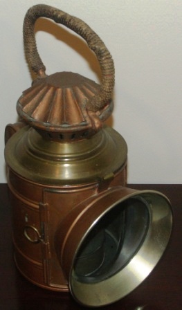 Early 20th century hand-held kerosene lamp. Made of sheet metal and brass by C.M. Hammar, Gothenburg Sweden. 