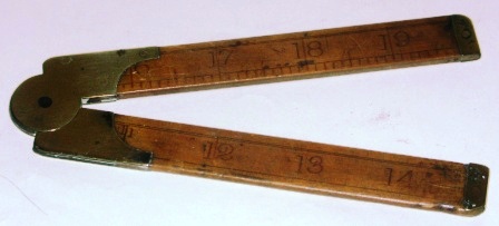 Early 20th century folding rule made of wood and brass