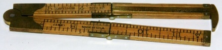 Early 20th century caliper/folding rule made of wood and brass. Manufactured in the US by Craftsman. No 132.