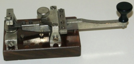 20th century telegraph / morse key, made of metal and mounted on bakelite base. 