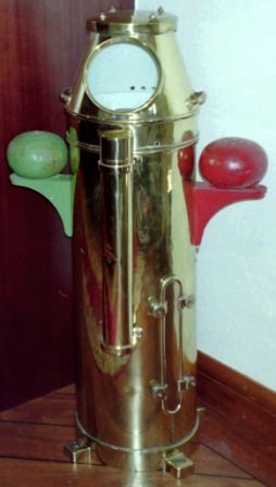 20th century brass ship's binnacle as used onboard naval ships. With floating compass card mounted in gimbals and electric illumination.