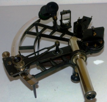 WWII sextant made by C. Plath, Hamburg. Brass frame, silver scale and vernier with a magnifier to assist scale readings. One telescope and sun-filters. 