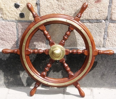 20th century six-spoked ships wheel. With double brass bands and central brass hub.