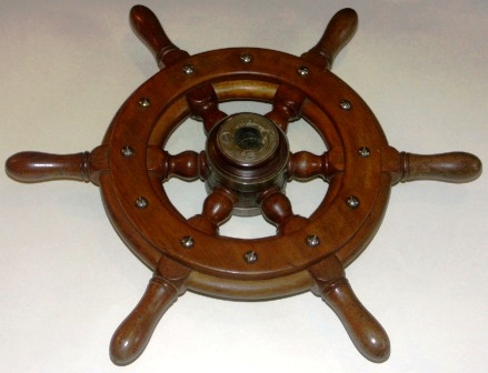 Mid 20th century six-spoked mahogany steering wheel.