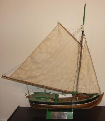 20th century built model depicting a Swedish wooden cargo boat, as used in Stockholm's archipelago for transportation of sand. Built by Albert Pettersson (Alpe), Norrtälje, in 1970.