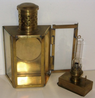 Early 20th century brass kerosene bulkhead lamp. With detachable burner/container.