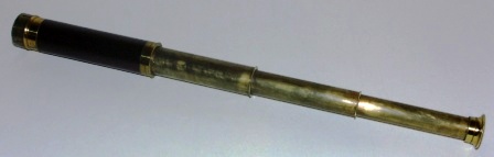 Early 20th century hand-held refracting telescope, maker unknown. Three brass draws and mahogany bound tube.
