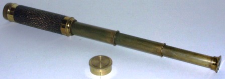 Early 20th century hand-held refracting telescope, maker unknown. With three brass draws and leather bound tube. 