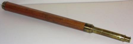 Conical shaped early 19th century hand-held refracting telescope, maker unknown. With one brass draw and mahogany bound tube.