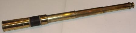 19th century hand-held refracting telescope. Maker unknown. Three brass draws and rope bound tube.
